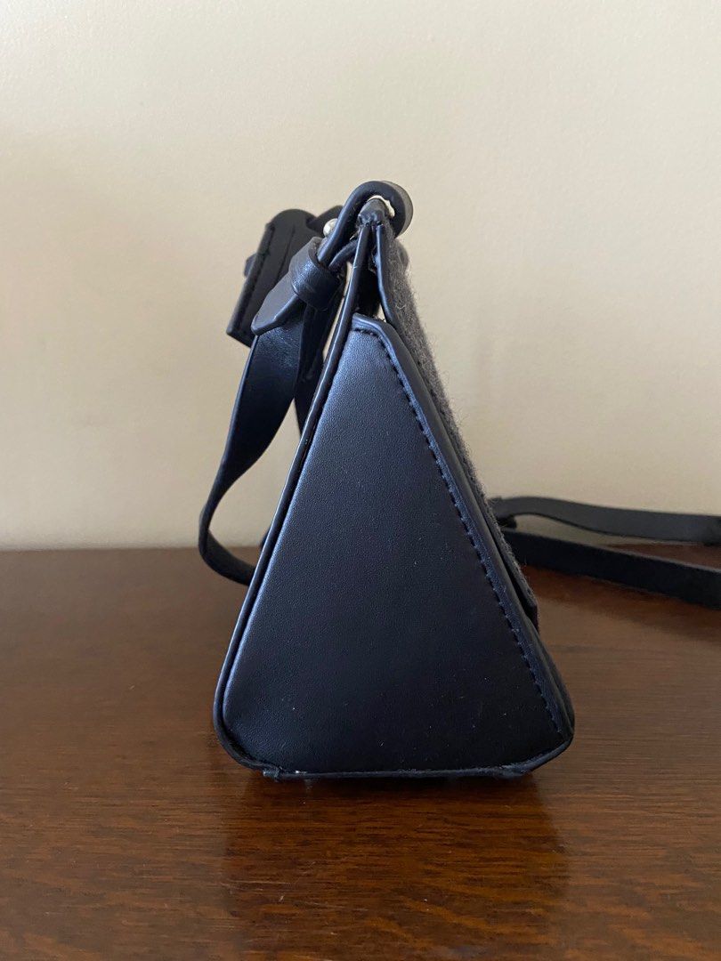 Charles & Keith Black Bag (Category: Cross-body Bags) located in Marikina City. Submitted by beinginspace (Listing ID 1222897047, Image 2). Description: Pu leather with felt flap top Rarely used but flaws and creases from storage Flaws include pu leather peeling. All shown in pictures 20 (w) x 15 (l) x 10 (d) cm.