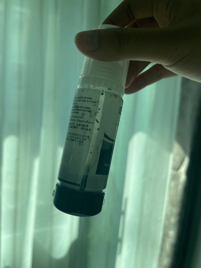 EPSON 033 black ink refill + freebie (Category: Printers, Scanners & Copiers) located in Makati City. Submitted by abbybit (Listing ID 1222805031, Image 3). Description: Sealed brand 65ml ink bottle. With free bottle 1/3 leftover .