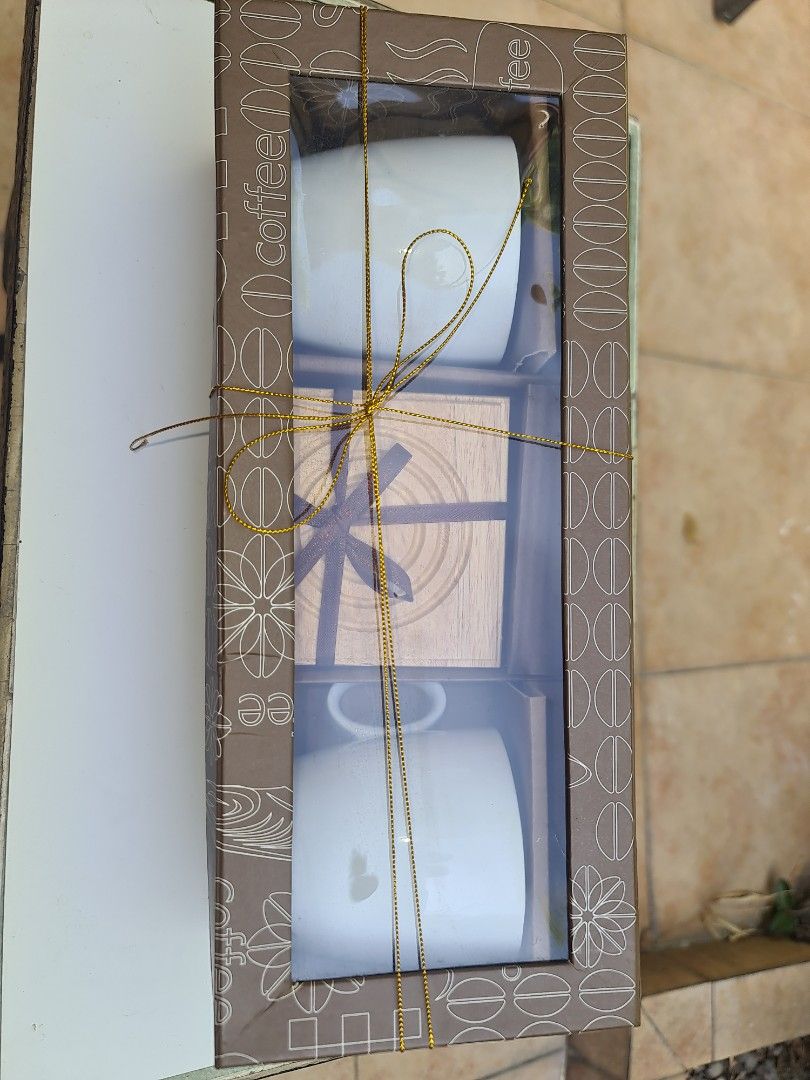 GOURDO'S Coffee or Tea set for 2 (Category: Coffee & Tea Tableware) located in Makati City. Submitted by harvesting_game (Listing ID 1222806125, Image 2). Description: Brand-new Coffee or Tea set. Comes with 2 porcelain cups, 2 wooden coasters and 2 teaspoons. Originally $12.00 at the DFS. Perfect as a gift for a couple or to be used to share Coffee or Tea with a dear friend over a good breakfast and an amusing story! enjoy!.