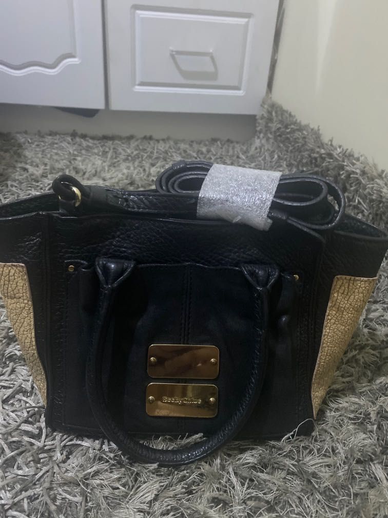 See by chloe small hand /sling bag (Category: Luxury Bags & Wallets) located in Pasig City. Submitted by pick_shoppe (Listing ID 1222858278, Image 1). Description: -vintage see by chloe -legit -no major flaws ( no rubs) -front metal with sign of used -9.5/10 in excellent condition -12” x 7”.