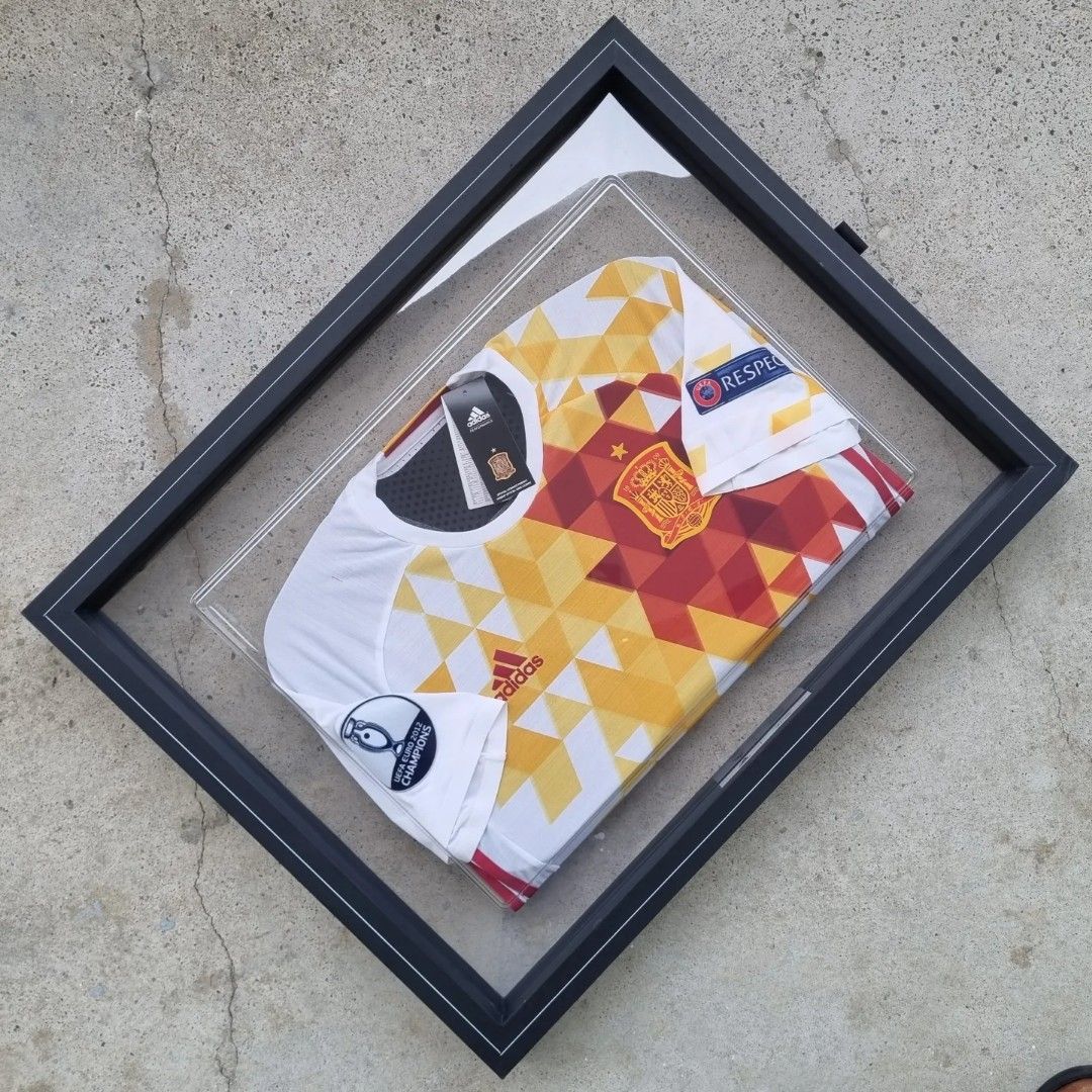 Spain Player Version Jerseys in Frames (Category: Other Sports Equipment and Supplies) located in Singapore. Submitted by subra5995 (Listing ID 1222947497, Image 1). Description: Similar to the earlier "ART" peice (Germany) in my collections. Truly amazing creations. Both the Spain jerseys comes in a set in a terribly huge box 😉. Can be hung together or as an individual piece on any wall. Both are authentic player version jerseys. In factory con