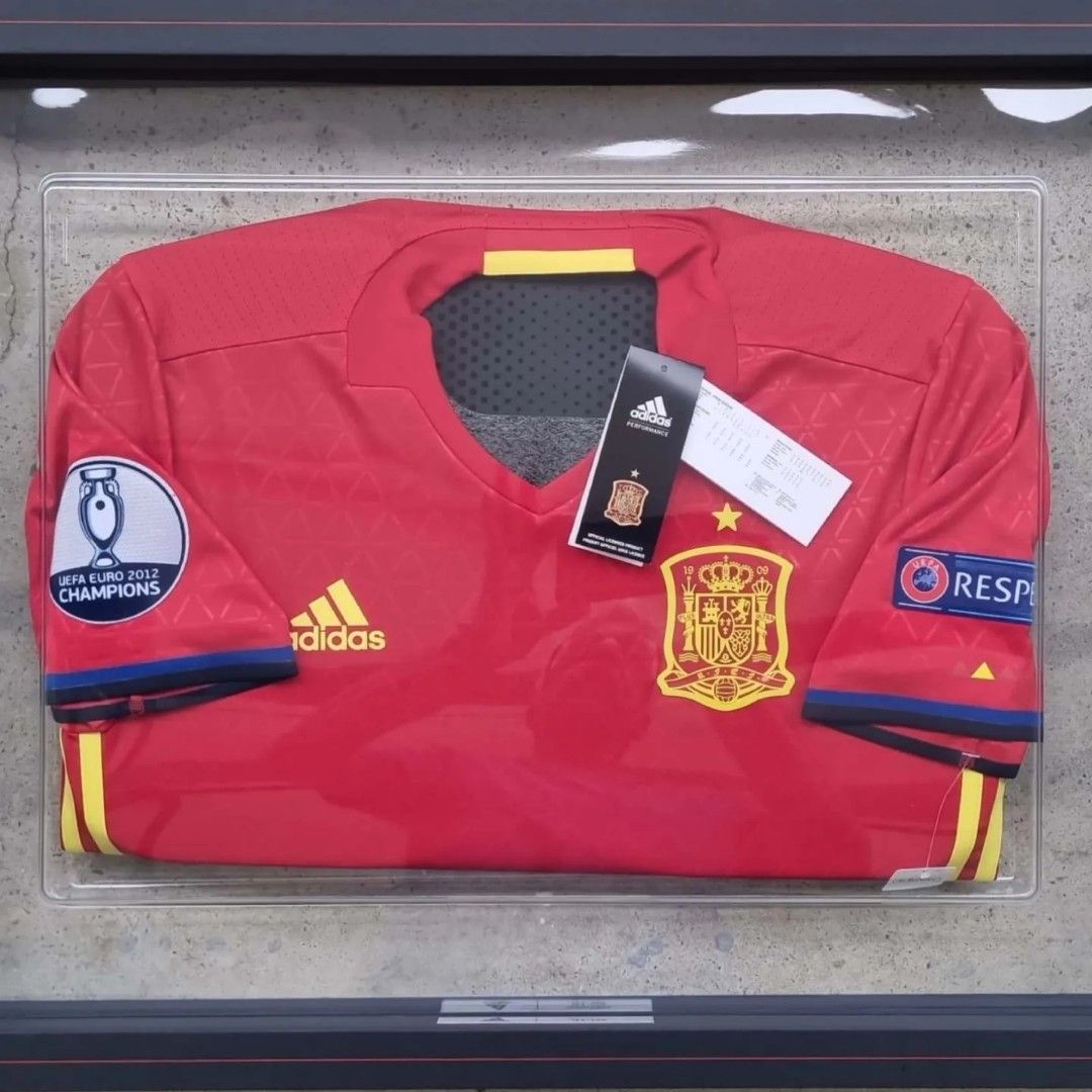 Spain Player Version Jerseys in Frames (Category: Other Sports Equipment and Supplies) located in Singapore. Submitted by subra5995 (Listing ID 1222947497, Image 4). Description: Similar to the earlier "ART" peice (Germany) in my collections. Truly amazing creations. Both the Spain jerseys comes in a set in a terribly huge box 😉. Can be hung together or as an individual piece on any wall. Both are authentic player version jerseys. In factory con