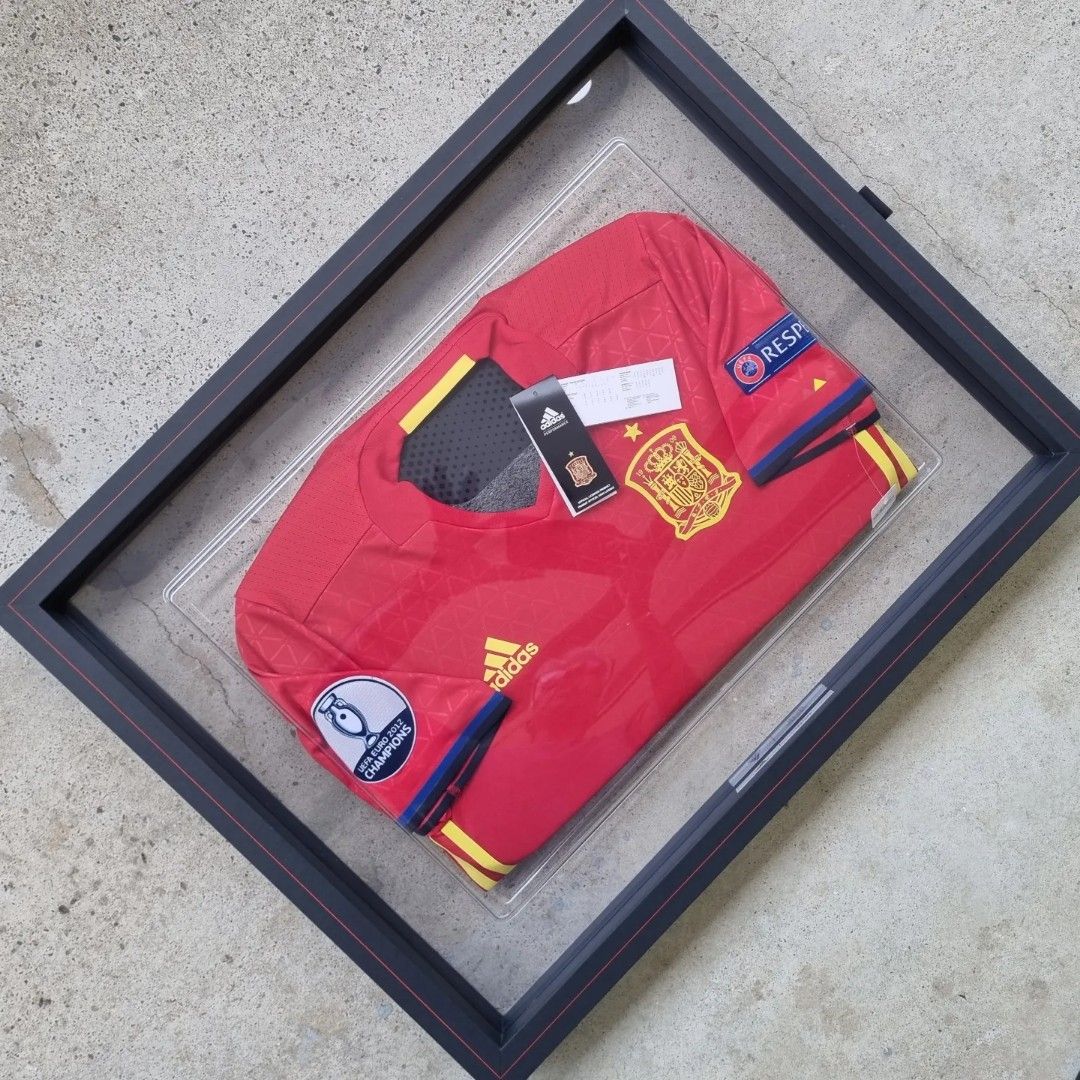 Spain Player Version Jerseys in Frames (Category: Other Sports Equipment and Supplies) located in Singapore. Submitted by subra5995 (Listing ID 1222947497, Image 3). Description: Similar to the earlier "ART" peice (Germany) in my collections. Truly amazing creations. Both the Spain jerseys comes in a set in a terribly huge box 😉. Can be hung together or as an individual piece on any wall. Both are authentic player version jerseys. In factory con