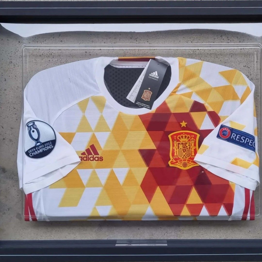 Spain Player Version Jerseys in Frames (Category: Other Sports Equipment and Supplies) located in Singapore. Submitted by subra5995 (Listing ID 1222947497, Image 2). Description: Similar to the earlier "ART" peice (Germany) in my collections. Truly amazing creations. Both the Spain jerseys comes in a set in a terribly huge box 😉. Can be hung together or as an individual piece on any wall. Both are authentic player version jerseys. In factory con