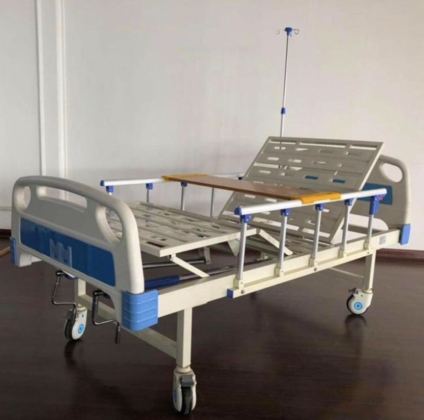 2 Crank Hospital Bed, with wooden dining table, IV pole, wheels on