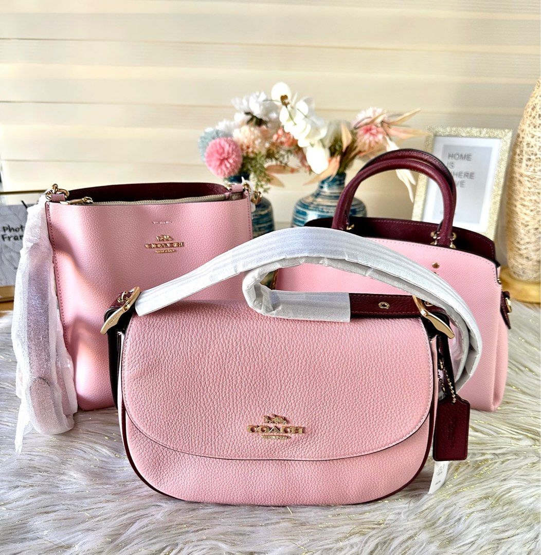 Coach Mini Lillie Carryall (Category: Luxury Bags & Wallets) located in Mandaluyong City. Submitted by shop_0n_the_spot (Listing ID 1223119208, Image 3). Description: Mini Lillie Carryall Color : Powder Pink/Wine Multi Product Details: Crossgrain leather Center zip compartment Snap closure, fabric lining Handles with 4 1/4” drop Outside open pocket Detachable strap with 21 1/2” drop for shoulder or crossbody wear Four protective feet at base 10 1