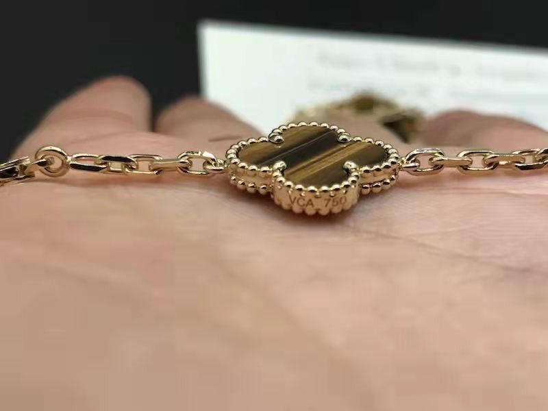 Louis Vuitton Yellow Gold Tiger Eye Bag Charm Pendant – Opulent Jewelers