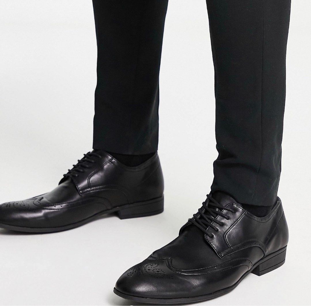 Black wingtip dress shoe