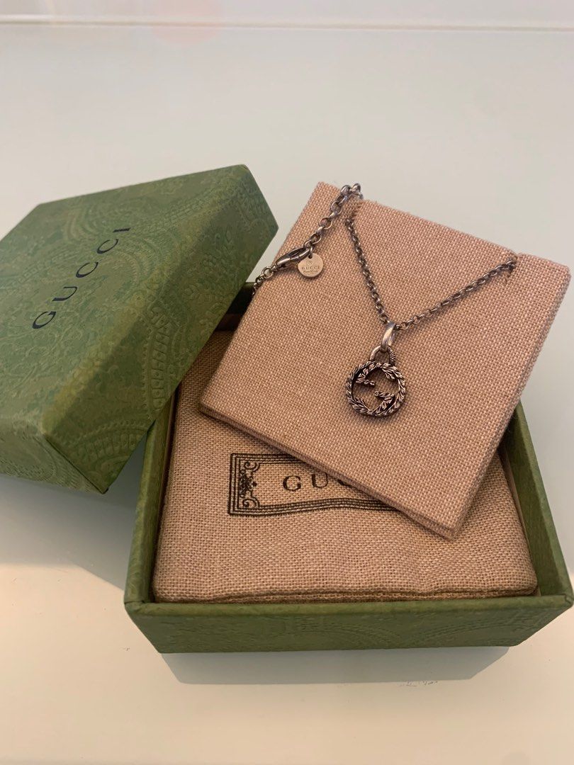 Gucci interlocking store g charm