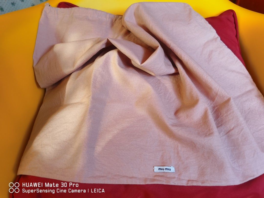 MIU MIU DUST BAG (Category: Luxury Bags & Wallets) located in Tuguegarao City. Submitted by thrift_gems (Listing ID 1223234542, Image 1). Description: 57 cm x 50 cm Malaki po ito...
