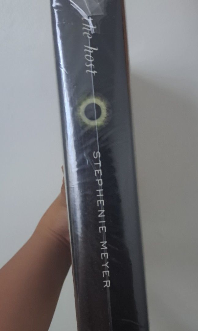 The Host (Category: Storybooks) located in Manila. Submitted by hexapom (Listing ID 1223386278, Image 2). Description: The Host by Stephenie Meyer on sale hardbound, plastic wrapped actual book on the photos location Makati.