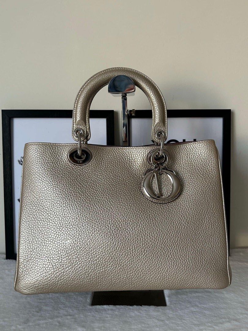 Christian Dior Diorissimo Bag (Category: Luxury Bags & Wallets) located in Manila. Submitted by bagislifeshop (Listing ID 1223523941, Image 2). Description: ▪️Christian Dior Diorissimo Bag▪️ ☑️Available in Pampanga ✅Condition: 8/10 ✅Material: Bull calf leather ✅Colour: Metallic Silver in SHW ✅Inclusions: Replacement dustbag, pouch and long strap .