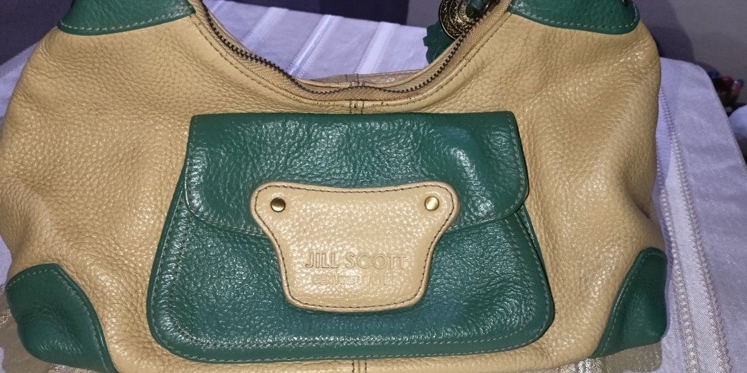 GENUINE LEATHER BAG BY JILL SCOTT PRELOVED (Category: Luxury Bags & Wallets) located in Cavite. Submitted by anna1033 (Listing ID 1219454870, Image 2). Description: PRELOVED AND EXPECT SIGNS OF USAGE MAAYOS PA ANG ZIPPERS AT BUO PA ANG BAG KAILANGAN LANG LINISAN AT I+POLISH HAND CARRY OR SHOULDER BAG, DEPENDE KUNG PAANO MO GAMITIN TOTOONG LEATHER AT MATIBAY COLOR BEIGE CREAM WITH GREEN.