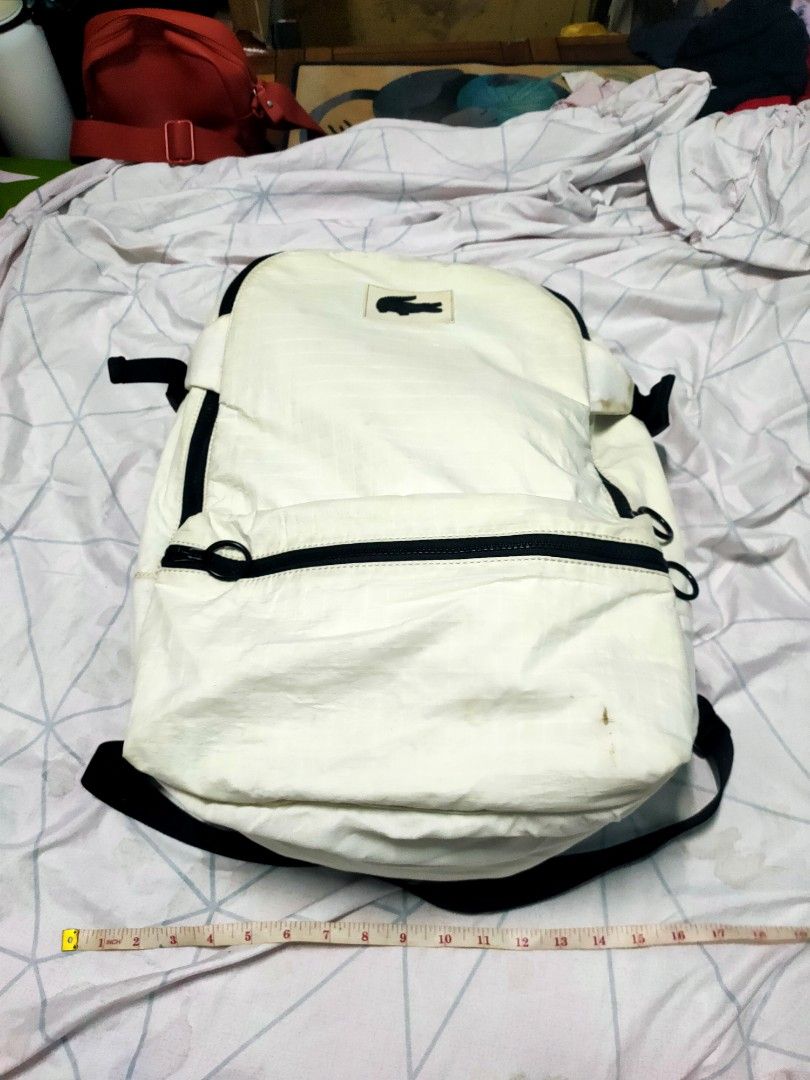 Lacoste (Category: Backpacks) located in Manila. Submitted by alilongthrift (Listing ID 1223523937, Image 3). Description: FOR SALE Lacoste backpack texture ng tela same ng windbreaker na jacket legit issue madumi need wash at yung part na leather white niya sa ilalim bakbak pero maayos pagkakaalis kaya tela na lang yung ilalim niya hindi leather MOST OF THE ITEMS ARE THRIFTED AND PRELOVED PLEASE MANAGE YOUR EXPECTATIONS NO RETURN NO EXCHANGE NO 
