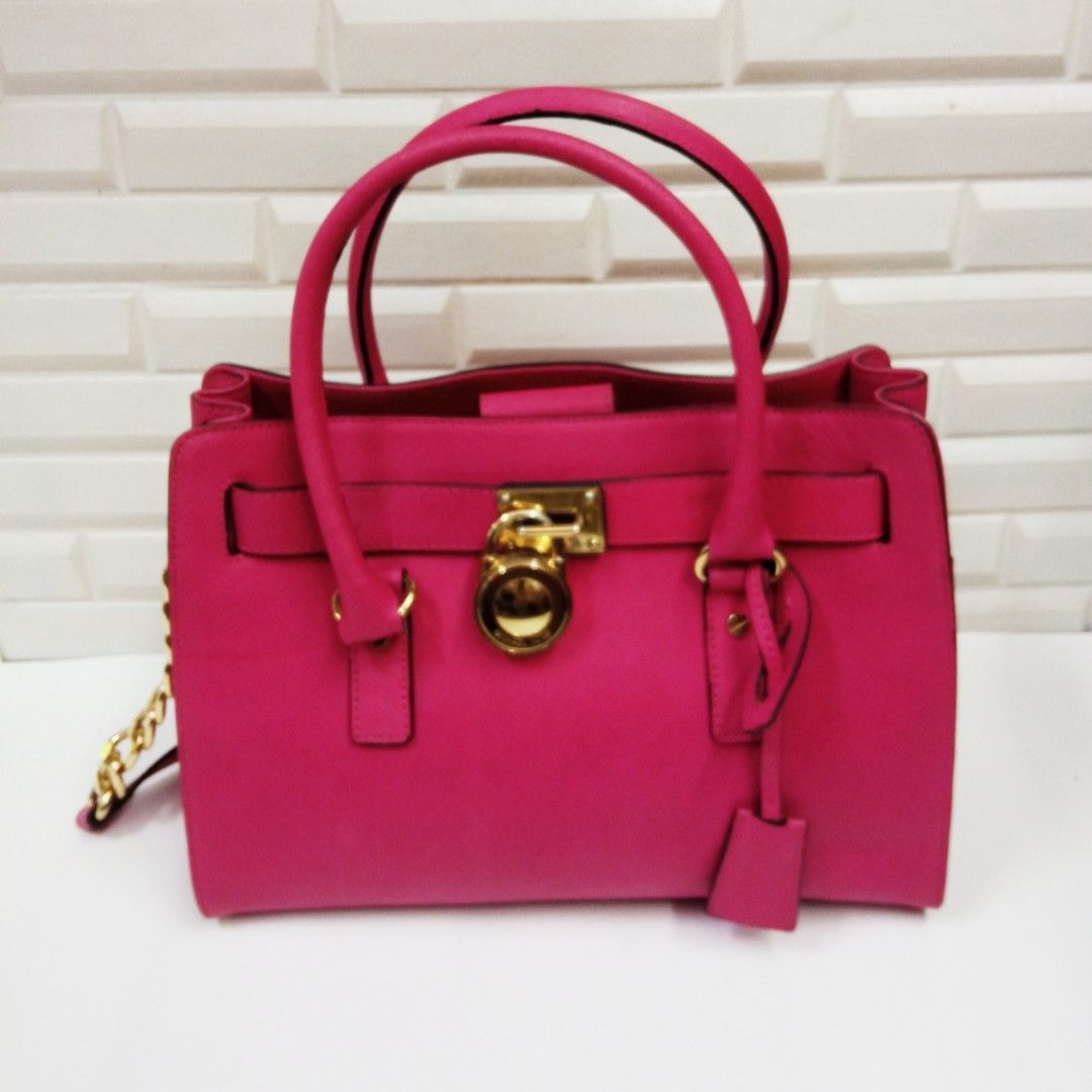 Neon pink online michael kors purse