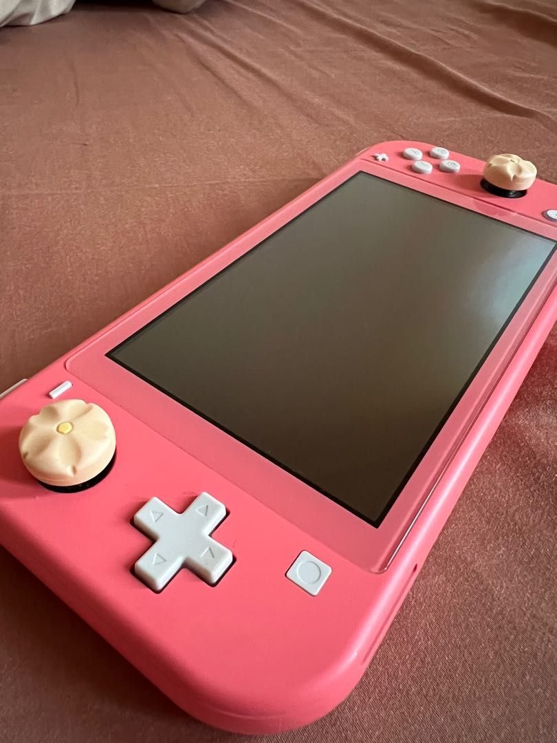 Nintendo Switch Lite (Coral) (Category: Nintendo) located in Quezon City. Submitted by _beanieee (Listing ID 1223532286, Image 3). Description: .