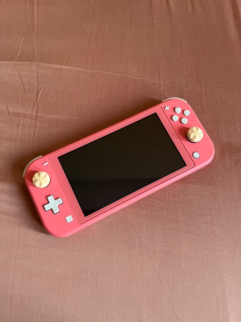 Nintendo Switch Lite (Coral) (Category: Nintendo) located in Quezon City. Submitted by _beanieee (Listing ID 1223532286, Image 1). Description: .
