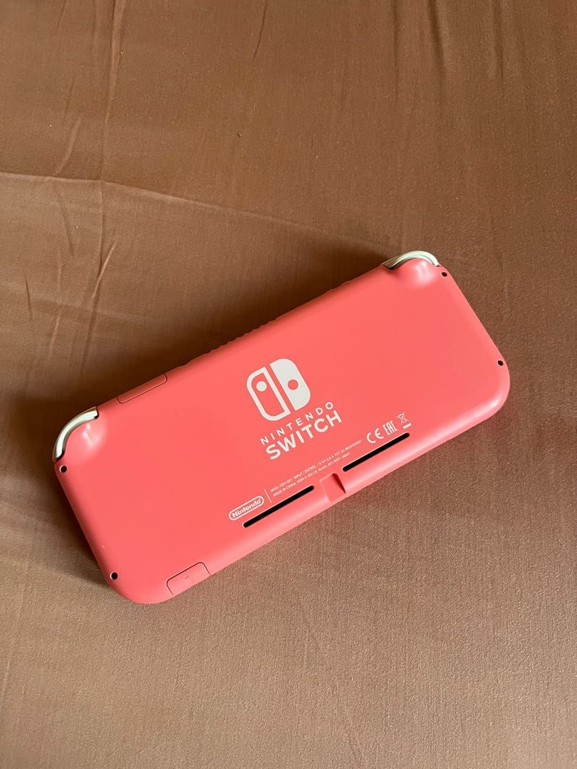 Nintendo Switch Lite (Coral) (Category: Nintendo) located in Quezon City. Submitted by _beanieee (Listing ID 1223532286, Image 2). Description: .