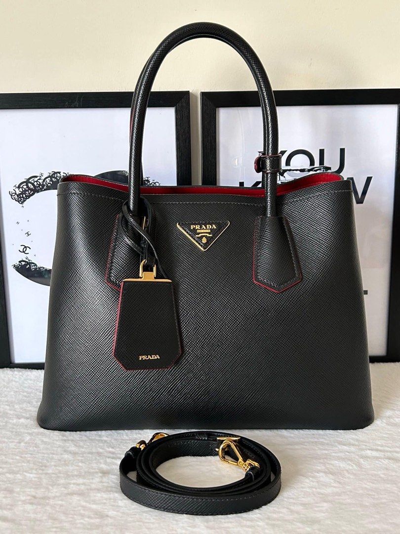 Prada Saffiano Cuir Double Bag (Category: Luxury Bags & Wallets) located in Manila. Submitted by bagislifeshop (Listing ID 1223523583, Image 2). Description: ▪️Prada Saffiano Cuir Double Bag▪️ ☑️Available in Pampanga ✅Condition: 8.5/10 ✅Material: Saffiano leather ✅Colour: Black in GHW ✅Inclusions: Replacement dustbag, authenticity card, carecard and long strap .