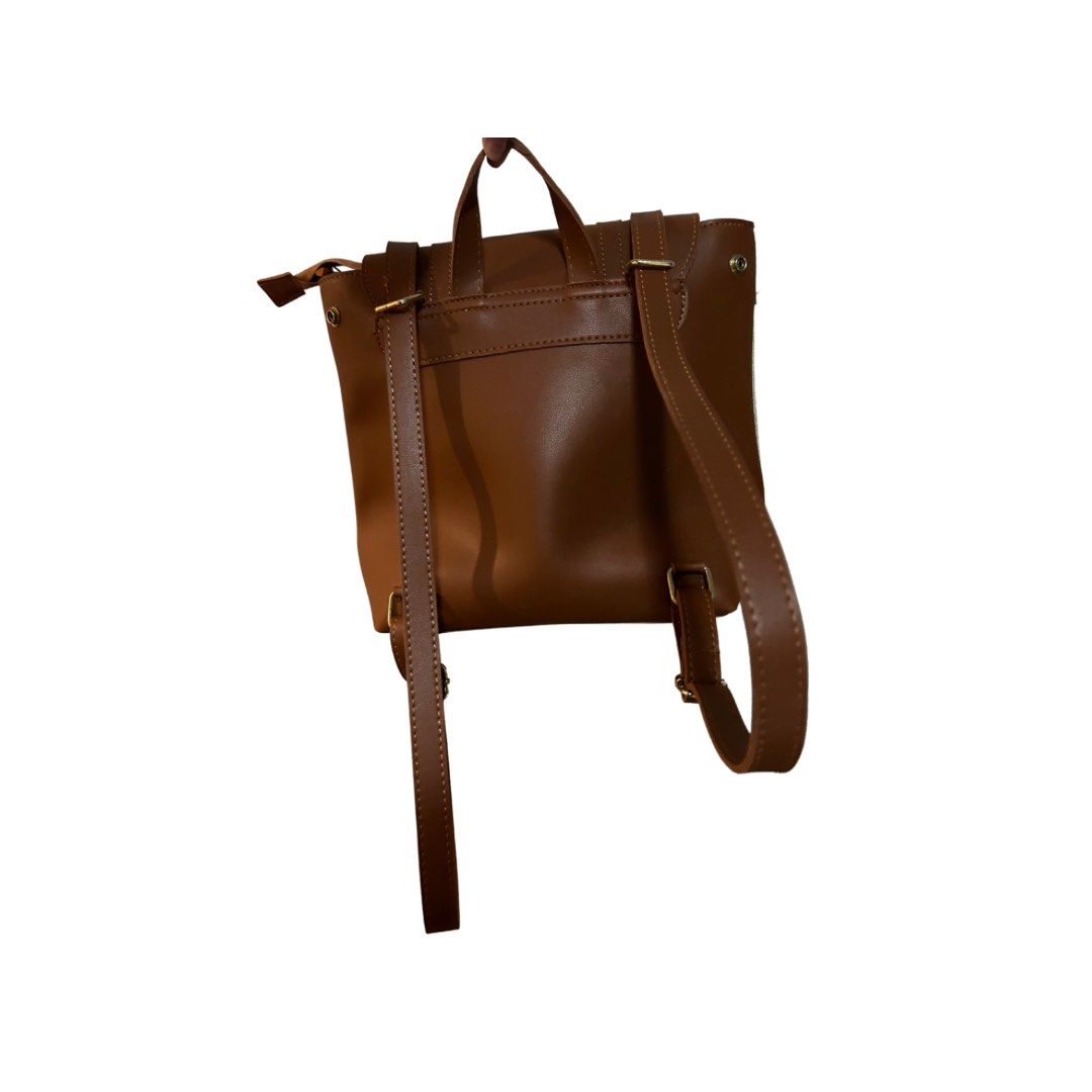 2 in 1 brown convertible bag (Category: Backpacks) located in Imus. Submitted by collset (Listing ID 1218515167, Image 3). Description: Backpack that can turn into a body bag .