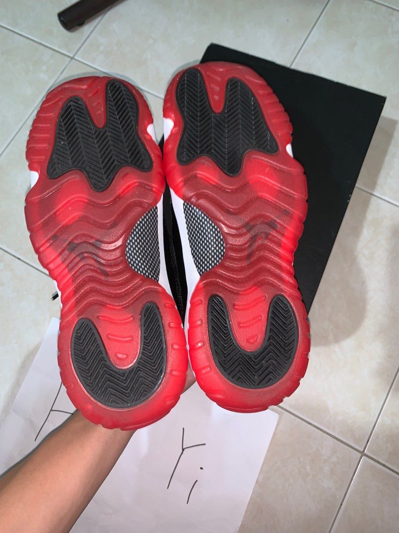 real vs fake jordan bred 11