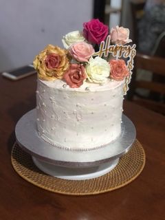 5 layer Mocha flavored themed cake with fresh flowers
