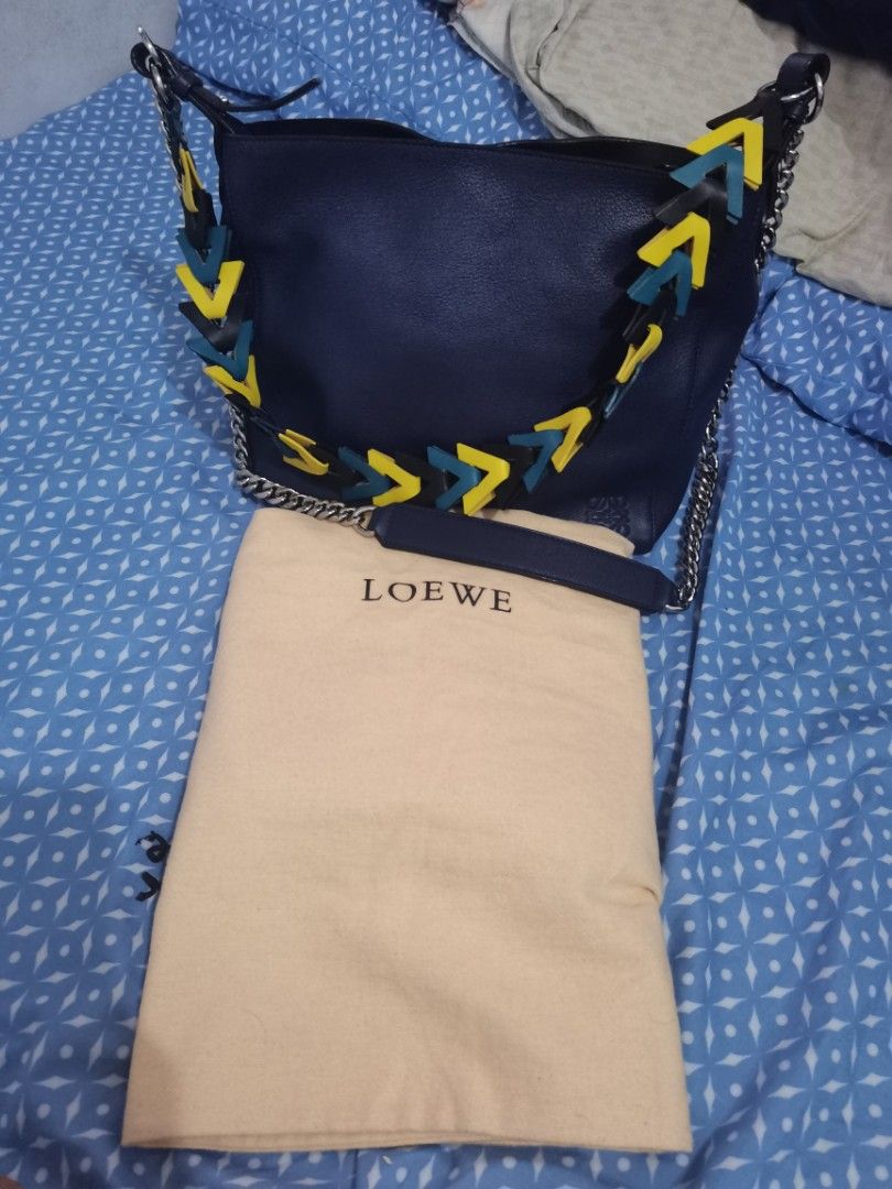 Authentic Loewe V Bucket Bag (Category: Luxury Bags & Wallets) located in Dinalupihan. Submitted by hydzsalva (Listing ID 1223682504, Image 2). Description: Authentic and rare Loewe V Bucket bag in navy blue color With dustbag inclusion.
