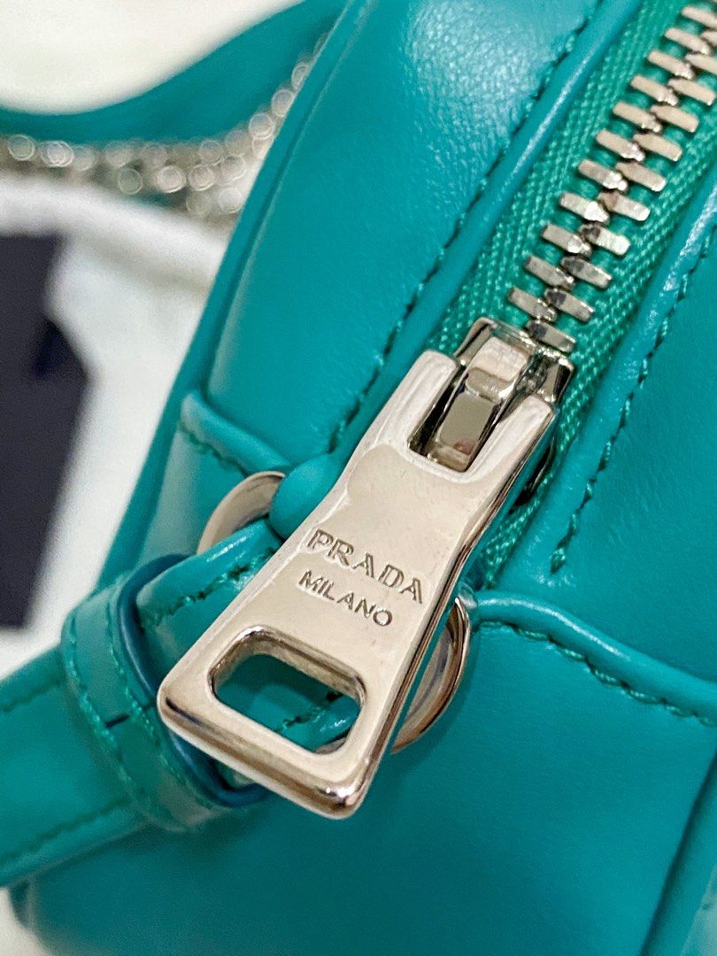 AUTHENTIC Prada Teal SHW Lambskin Camera Bag (Category: Luxury Bags & Wallets) located in Quezon City. Submitted by closetofcoco (Listing ID 1223688308, Image 3). Description: GUARANTEED AUTHENTIC PM FOR INQUIRIES NO LOW BALLING.