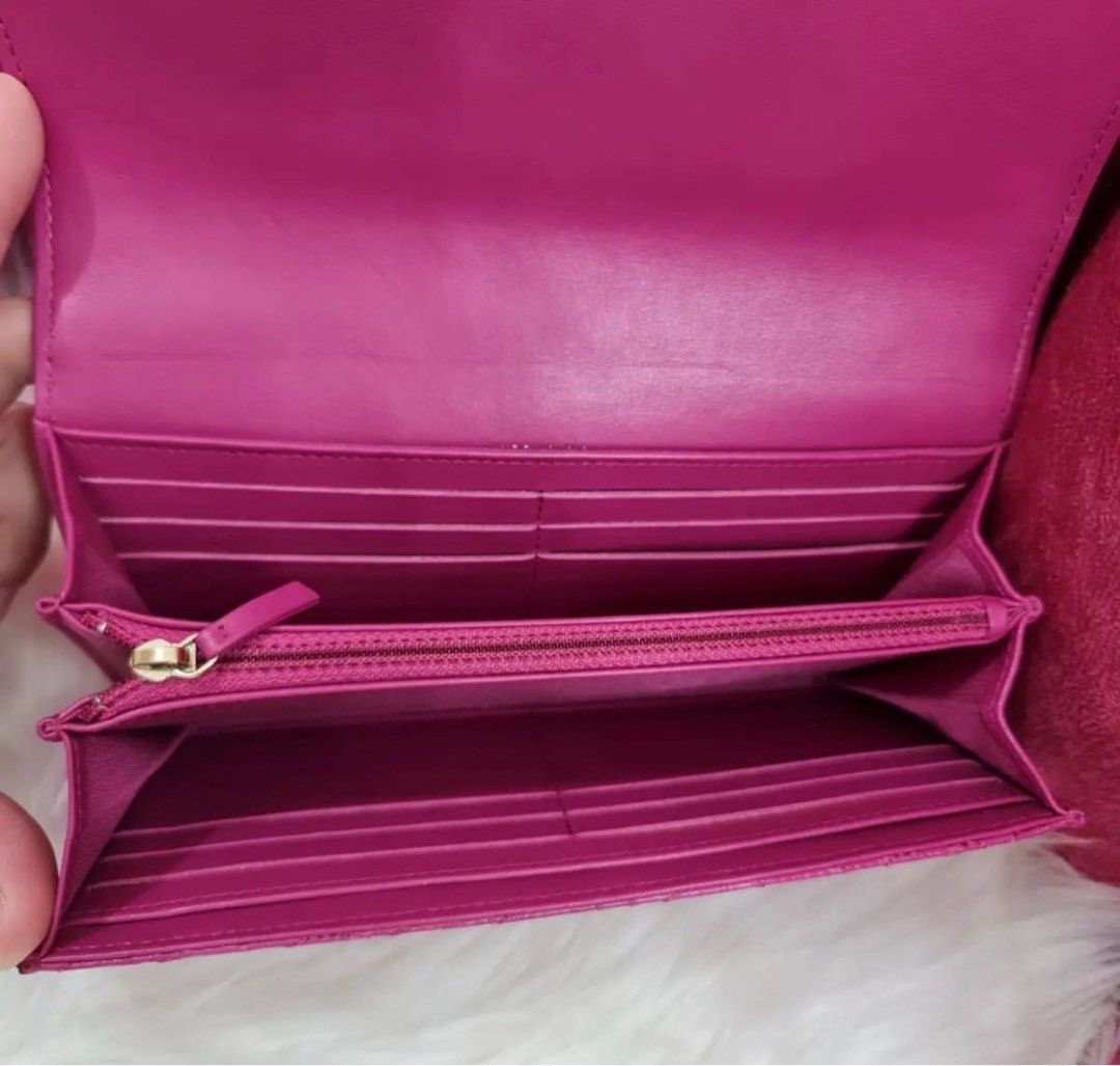 Chanel camellia long wallet (Category: Luxury Bags & Wallets) located in Manila. Submitted by dendc (Listing ID 1223697268, Image 2). Description: Chanel camellia long wallet in fuschia 9/10.