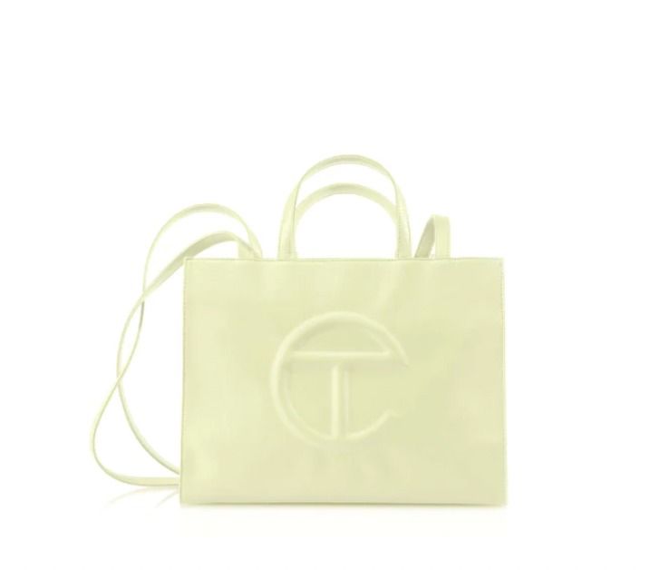 Telfar Medium Glue Shopping Bag (Category: Luxury Bags & Wallets) located in Manila. Submitted by sarafate (Listing ID 1223746796, Image 1). Description: Negotiable Featuring a double strap (handles and cross-body straps), embossed logo, a main compartment with magnetic snap closure and internal zipper pocket. Made from faux leather and twill lining. Bag is packaged in a drawstring bag with screen-printed logo. Medium fits a laptop + your daily s