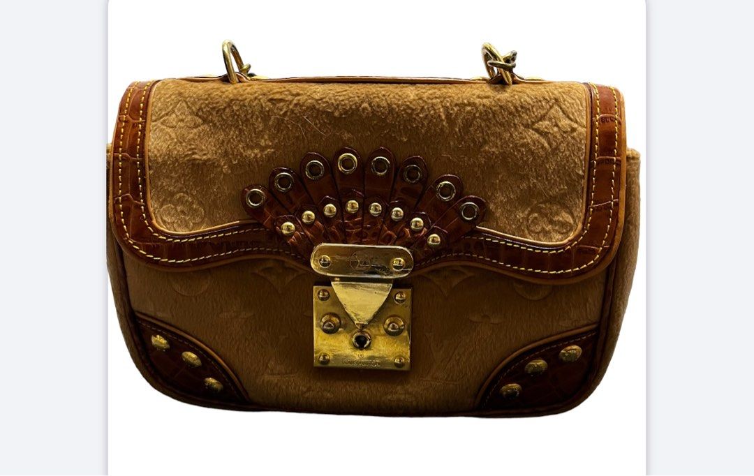 Louis Vuitton (Category: Luxury Bags & Wallets) located in Makati City. Submitted by fabiloushop (Listing ID 1223834107, Image 1). Description: Unique style Hand bag Mini size - can fit wallet and phone Gamoza fabric with leather Complete rivets No code .