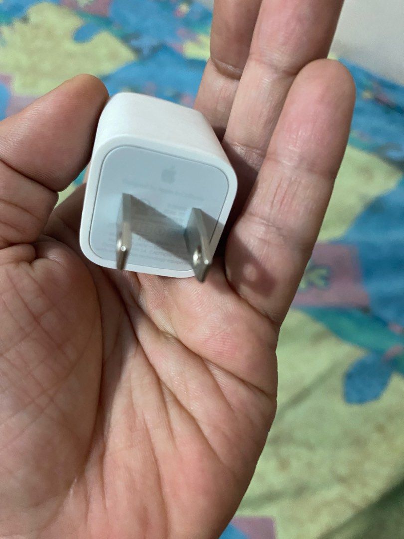 Original Iphone 5w adaptor (Category: Chargers & Cables) located in Pasig City. Submitted by fiercemoon_f4c53e (Listing ID 1223784666, Image 1). Description: Preloved item good as new no issues in good condition .