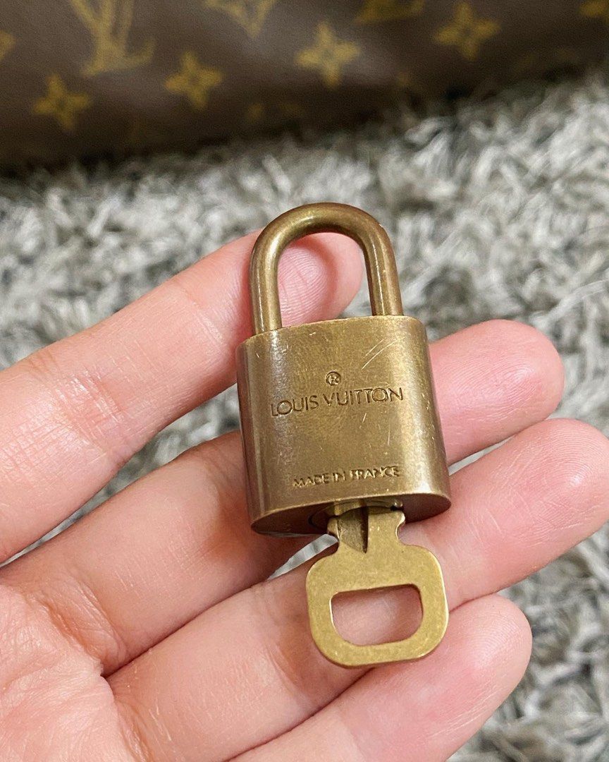 Authentic gold Louis Vuitton lock, was previously