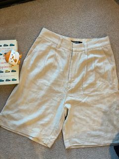 Beyond her beige pants
