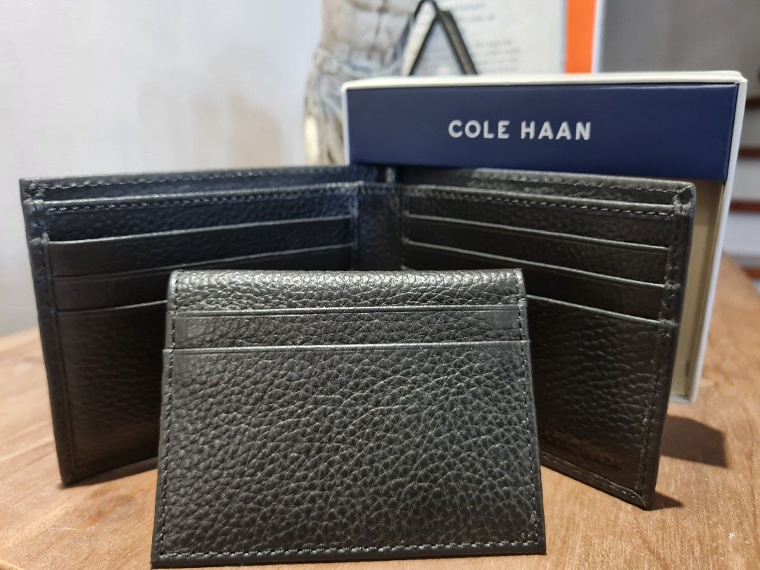 Cole Haan Pebbled Leather Bi-Fold Wallet (Category: Wallets & Card Holders) located in Paranaque City. Submitted by r___m (Listing ID 1218618290, Image 3). Description: Bi-fold wallet crafted from pebbled leather in a sleek design embossed with logo lettering. •Bi-fold closure •Two inside bill compartments •11 inside card slots •Leather/textile lining •Leather •Imported SIZE 4.75"W x 3.75"H x 1"D.