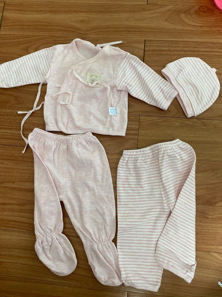 Newborn set (side tie longsleeves, 2 pants, bonnet) (Category: Babies & Kids Fashion) located in Quezon City. Submitted by lovedlots (Listing ID 1218613091, Image 1). Description: Small stain on shirt Soft and comfy cotton material Newborn to 3 months.