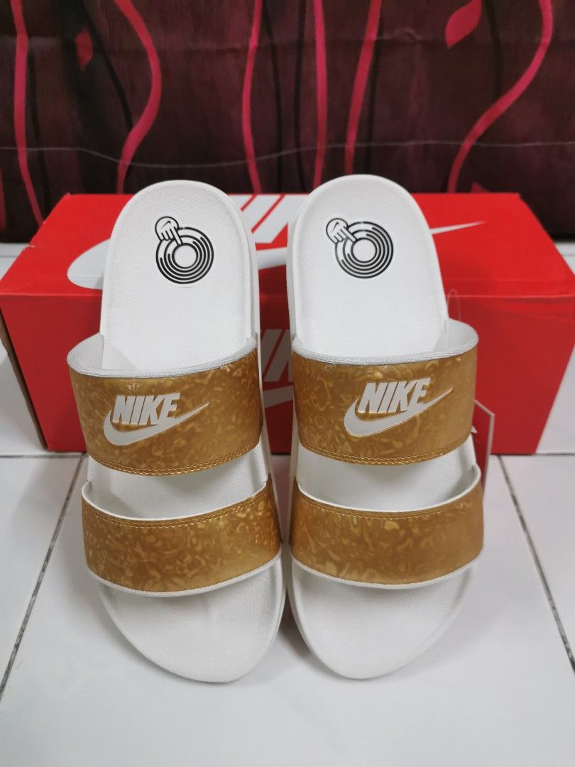 Nike rose sales gold sliders