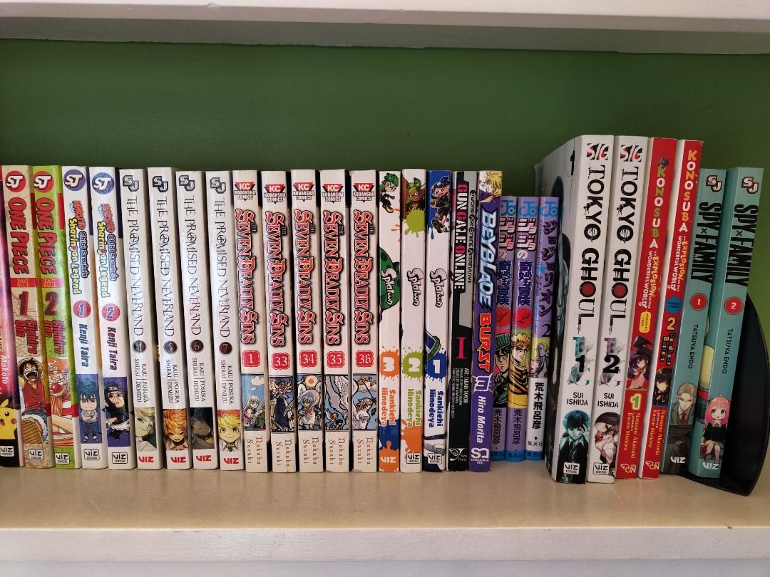 Various manga books Demon Slayer, My Hero Academia, One Piece, Naruto