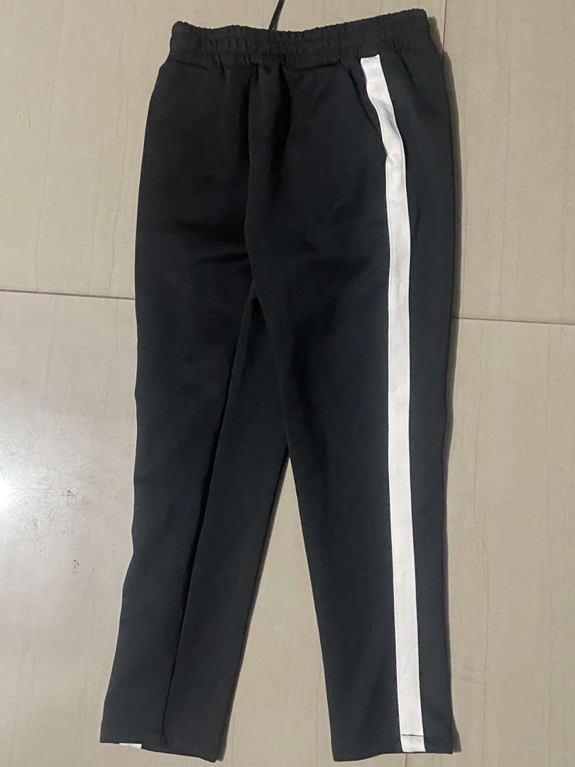 Black Trackpants with side white stripes on Carousell