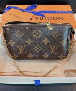 LOUIS VUITTON, Mini Pochette Accessoires Monogram Vivienne Fuchsia Pink,  monogram canvas, Collection 2021, gold-plated chain, marked LOUIS VUITTON  PARIS made in France, date code, (Vivienne is the house Vuitton mascot).  Vintage Clothing