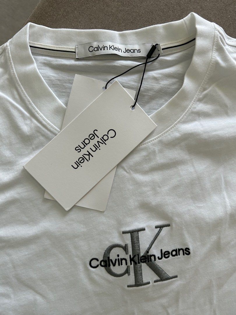 Authentic brand new with tag Calvin Klein white tshirt with embroidered  logo, Men's Fashion, Tops & Sets, Tshirts & Polo Shirts on Carousell