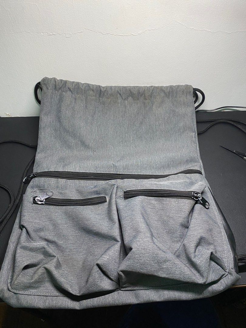 Helios draw string bag (Category: Backpacks) located in Makati City. Submitted by vanbustling (Listing ID 1219083992, Image 2). Description: Helios Drawstring bag gray.