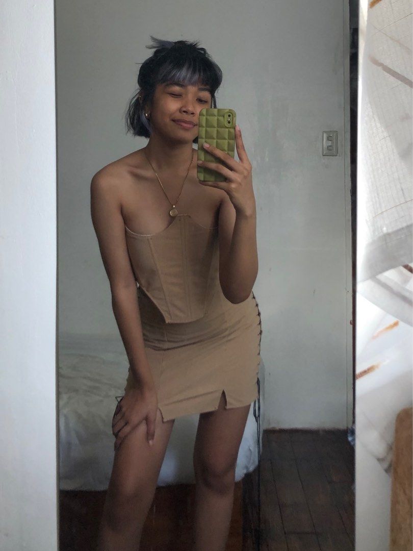 Beige Corset & Skirt Coords (Category: Sets or Coordinates) located in Manila. Submitted by sanesagi (Listing ID 1219269114, Image 2). Description: never worn. this is from threadandwear.ph on ig! perfect for smexy gurls who love to party!! skirt's fabric is quite thin. everything can be adjusted with the strings so can fit up to semi-med <33.