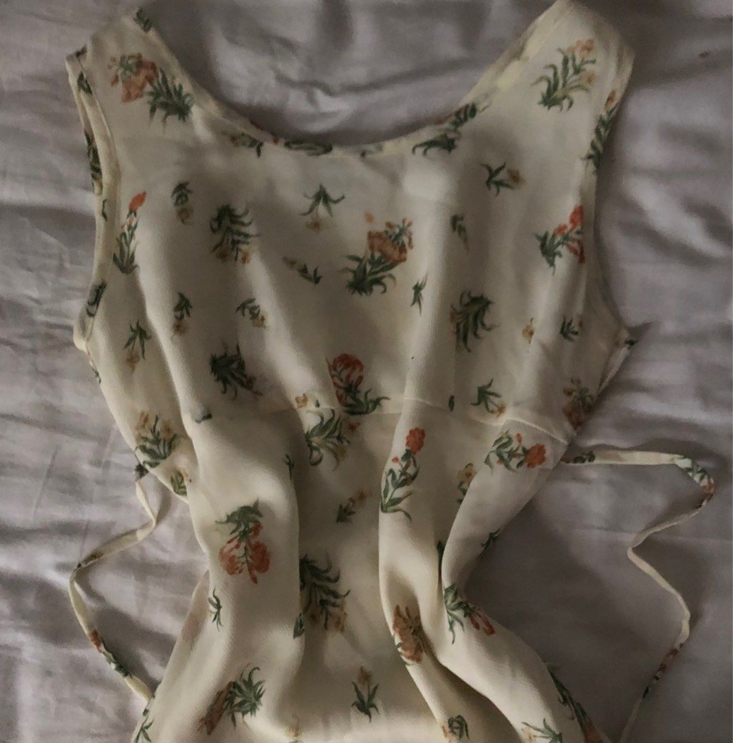 Cottagecore Cream Maxi Dress (Category: Dresses) located in Manila. Submitted by sanesagi (Listing ID 1219268235, Image 3). Description: worn once. super super pretty irl <33 has zipper on the side and can be tied on the back. super flowy & presko. with inner lining but better if you wear plain undergarments bc halata parin onti model stats: height - 5'1, waistline-26 mop: gcash, bpi courier: gogoexpress.