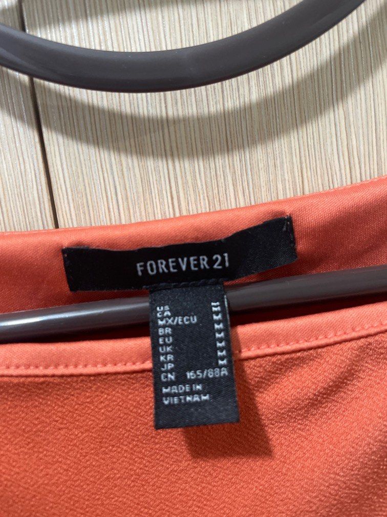 F21 Orange pink dress (Category: Dresses) located in Pasig City. Submitted by ___k8 (Listing ID 1219174202, Image 2). Description: Super love this dress! Flattering color 💖🧡 Rfs: won’t fit me anymore 🥲😭.