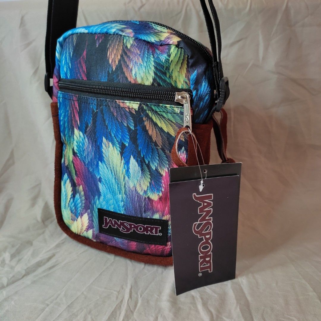 Jansport Sling Bag With Leather bottom (Feather Design) on Carousell