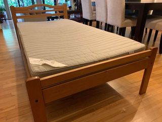 Single bed with solid wood frame and mattress