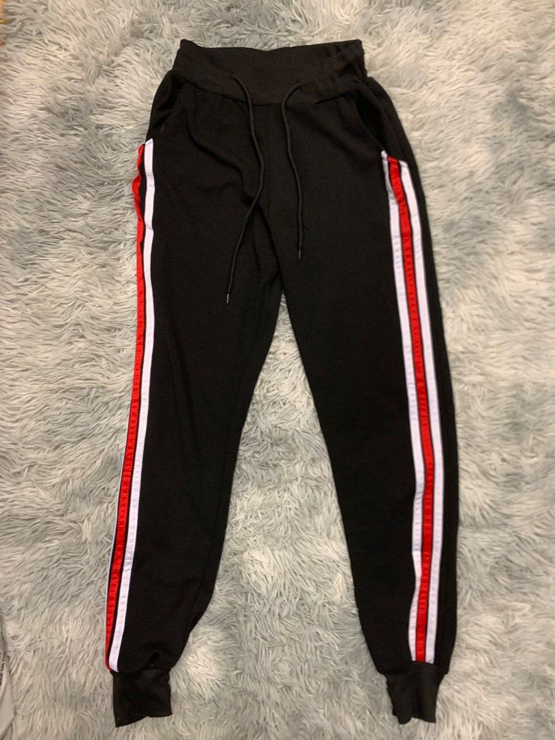 Red black top and white joggers