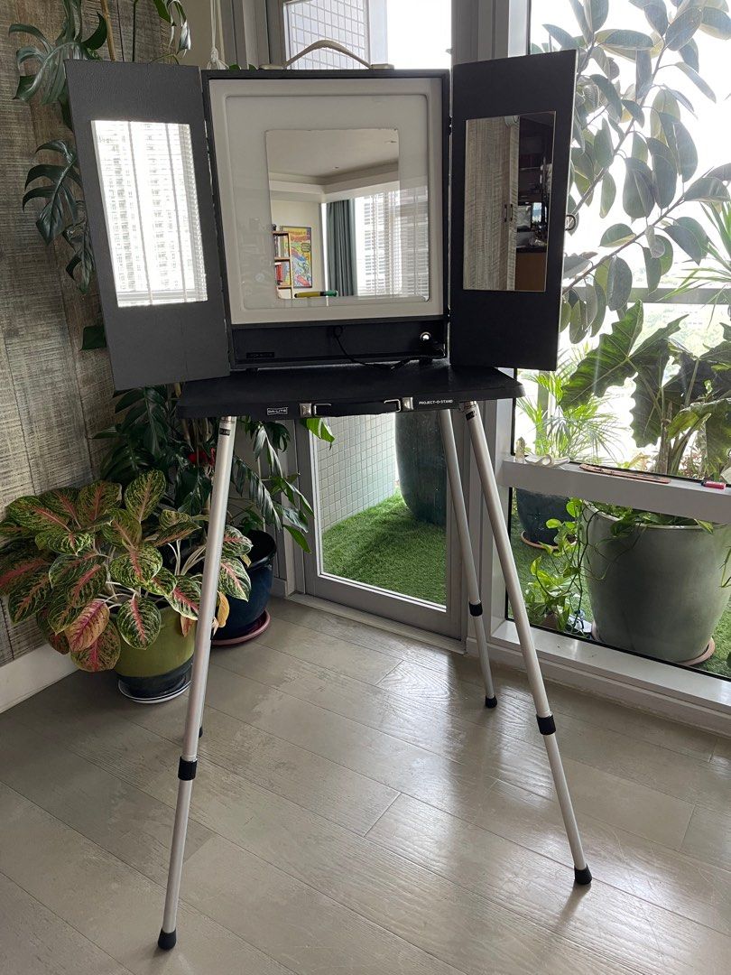 THE MAKEUP LIGHT PORTABLE VANITY SET (Category: Lighting & Studio Equipment) located in Pasig City. Submitted by niftythriftyandthriving (Listing ID 1219518501, Image 1). Description: Makeup Artist’s Luxury Mobile Station Setup Bundle Includes the following: ✅ The Makeup Light Portable Vanity Mirror Graphite w/ Padded Bag ✅ Da-Lite Project-O-Stand Table ✅ Magnacart Hand Truck w/ Bungee Cord ✅ Telescopic Director’s and Makeup Chair 31” w/ Bag Prel