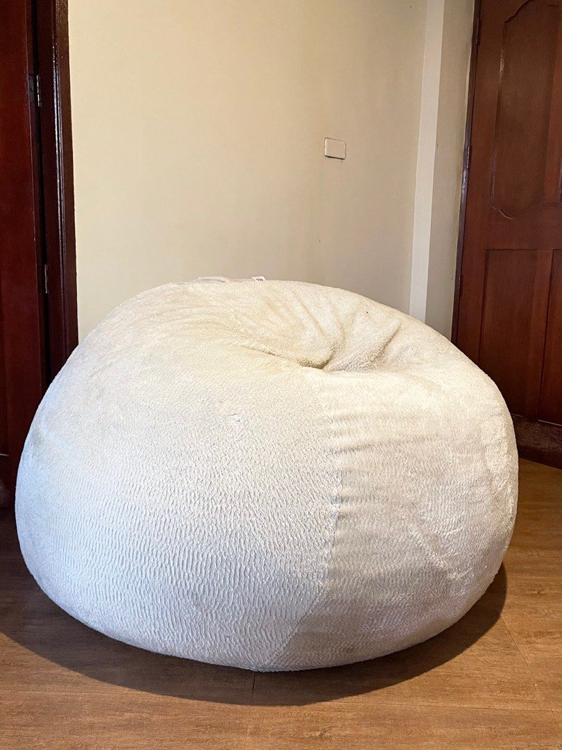 Giant beanbag sofa (Category: Sofas) located in Silang. Submitted by girlyouneedthis (Listing ID 1219660468, Image 1). Description: Original price 45k, now for only 28k, with lining, inclusions are 1 cream furr cover, 1 cream suede cover, and 1 black velvet cover. This is super steal! And super huge! Just needs some dry cleaning. .
